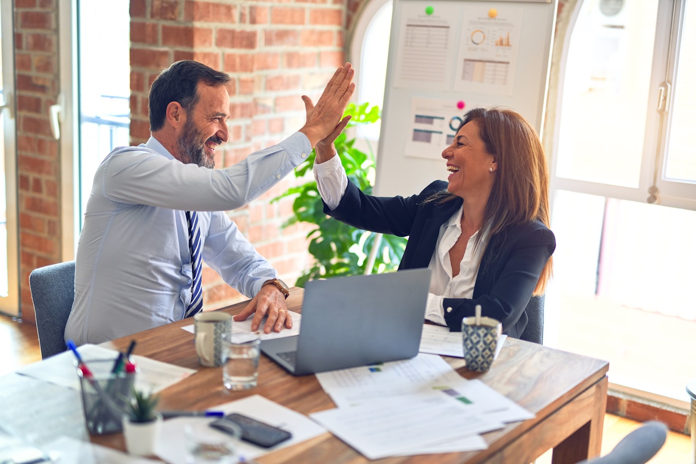 Multi-branch owners reviewing sales